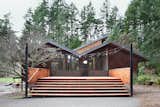 This 1974 Japanese-inspired house, designed by famed Pacific Northwest architect Gene Zema, was recently renovated but retains its original wood shingles. The richly-crafted interior features cedar ceilings, stained fir beams, and oak flooring.