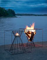 The Boo Fire Basket from Skargaarden is made of black lacquered steel. Designed to fit several logs for an outdoor fire, the Boo can also be overturned to hold a candle or lantern.