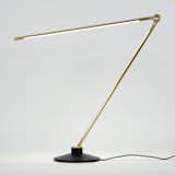 Sleek and streamlined, THIN by designer Peter Bristol for Juniper is an innovative task light that generates the maximum amount of light while using minimal materials. The result is a powerful lamp that can produce over 500 lumens of warm white light while remaining modest in size. Shown here in waxed brass, this task light will add sophisticated function to a desktop.
