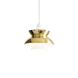 The Doo Wop Suspension Light, originally called the Navy Light, was first designed in the 1950s in collaboration with the Navy Buildings Department. The pendant was prevalent during this time period because of its practical functionality and distinctive look. This modern version of the classic lamp features a stunning brass shade that will elevate an interior space.