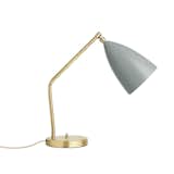 Designed by Greta Grossman, the iconic Gräshoppa series was first produced in 1947. Influenced by European Modernism, the lamp balances minimalism, high function, and distinctive personality. The Gräshoppa Table Lamp is characterized by its angled stand, which gives the lamp a sense of suspended movement, like a grasshopper ready to jump.