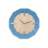 ThisCaldera Wall Clock created by Schmitt Design features a maple face with a steel blue geometric design.