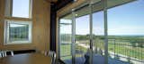 The four-bedroom, two-bathroom house is stacked vertically, with public spaces on each floor.