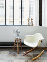 A vintage Eames rocking chair occupies a corner of the living room.