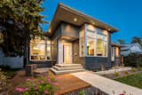 Dave and Maria sold their home and rented until an ideal site appeared: one with ample space and mature trees. The exterior is durable and low-maintenance thanks to its HardiePanel siding and metal-clad windows; most of the home's stairs (such as the entrance steps seen here) are short and can be easily ramped for future wheelchair access.