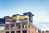 Set atop a 1908 warehouse in the Courtenay Precinct of Wellington, New Zealand, three contemporary apartments by Architecture Workshop glow like lanterns at dusk, signaling a new day for this once-seedy neighborhood.