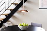 The Signal Pendant Light is at once simple and sculptural. Comprised of a spun aluminum shade that is met with a polished central stem, the Signal Pendant Light hovers above a dining room table, kitchen counter, or living room interior. The light uses warm LEDs and indirect light to create a welcoming diffusion of light that remains unobtrusive in a space.