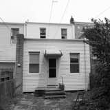 The home's rear exterior before the renovation.
