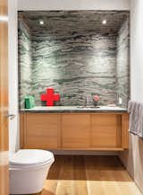 Severns put in a glass-block wall to separate the office from the guest bedroom, and created brand-new bathrooms.