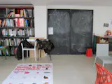 Inside, the main floor of the studio is pleasantly cluttered with books, sketches, chair prototypes, finished products, and a blackboard where the brothers hash out their ideas. On the floor is a poster for their "Album" exhibition in Bordeaux. Downstairs is a woodshop and prototyping studio; upstairs are offices and a photo studio.