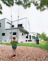 The eco-friendly Ann Arbor home of Tom McMurtrie, Genia Service, and their son Gary features a brilliant reflective steel cladding.  Search “eco-friendly-carpeting.html” from Dwell Revisits an Eco-Friendly Ann Arbor Home 9 Years Later