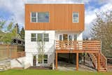 The exterior features cedar tongue and groove siding and James Hardie panels. Due in part to smart material choices, the house is 51% more efficient than the standard newly constructed home and 61% more efficient than a typical existing home.