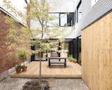On the terrace, an eastern-cedar deck serves as a mid-city oasis.  Photo 15 of 15 in A Transformative Duplex Renovation in Montreal