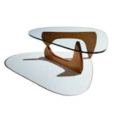Japanese-American sculptor Isamu Noguchi designed his famous three-legged coffee table in 1948. The perfect balance of forms, the piece has become a staple in modern homes.
