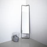 The Kaschkasch Floor Mirror is a decidedly modern home accent that is designed with small spaces and apartment living in mind. The full-body mirror has a triangular shaped frame, making it easy to fit into the corner of a room.  Photo 4 of 5 in Small Spaces from Reflect On This: 10 Modern Mirrors We Love