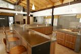 A lengthy steel bar, a recurring motif in Hawkins' work that can be seen in his Reno kitchen remodel, is the centerpiece of the communal area in this Washoe Valley, Nevada, home.