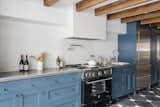 The lovely cornflower-blue kitchen cabinets in this Brooklyn, New York, home by Elizabeth Roberts Architecture &amp; Design were professionally painted.
