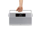 The Geneva WorldRadio pairs throwback looks with modern technologies. A contemporary version of the traditional world receiver, it can broadcast all radio stations. The radio also has a built-in wireless Bluetooth receiver, so it can broadcast Internet stations. It includes a sturdy carrying handle for easy transport.