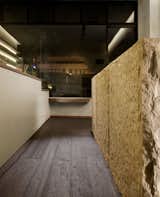 Arcanum Architecture used wood, concrete, and stone to create a distinctive interior for the shop.