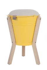 Introduced in 2008, the Bucket Stool "was inspired by our desire to combine handmade and precision-cut elements, as this best describes the juxtaposition of craft and design in South Africa," Pedersen says. "The buckets are handmade in townships around Cape Town by craftsmen who have been working with sheet metal for generations. Each bucket is cut out by hand and hammered into shape with the most basic and ingenious of systems, along with our plus-sign logo. The legs and seat are CNC-cut from Scandinavian birch plywood, and the seat flips over to function as a side table. We have two models, a regular stool and a barstool."  Photo 3 of 16 in Two Cool Surfers Design Some Serious Furniture
