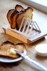 "We find ourselves in the marginal group who still love a simple slice of toast and decided to design something to emphasize this as well as solve a problem that hasn't been addressed for a good 20 to 30 years," Pedersen says of this toast rack. "The size and shape of bread has changed, and so we found that our old inherited toast racks didn't work anymore! Our solution is a simple combination of a wooden breadboard base with a steel or brass rack, which clips in nicely and holds toast [slices] of varying thickness."  Photo 5 of 16 in Two Cool Surfers Design Some Serious Furniture