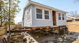 In Breezy Point, Queens, one of the communities hit hardest by Superstorm Sandy, Azaroff's +LAB architects raised a damaged home to avoid future floodwater.