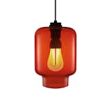 The Plumen 002 has a screw fitting that fits into any lamp that accommodates a standard screw bulb, and its 7-watt power is equivalent to a 30-watt incandescent in terms of illumination. It is shown with a red Calla Pendant Light from Niche Modern.