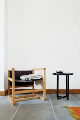 One corner holds a chair and table designed by Verheyden.