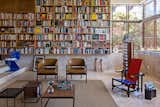 Architect Gustavo Costa calls the home library the "project’s heart." This central space houses the owner’s expansive collection of about 5,000 books, and acts as a meeting place for friends and colleagues. A Gerrit Thomas Rietveld Red and Blue chair completes the space.