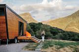 Brian and Joni Buzarde’s self-designed home sits on a customized chassis by PJ Trailers that’s just eight and a half feet wide. The 236-square-foot trailer is clad in cedar.