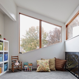 Hufft Projects carved away a second level in this home for the kids' bedrooms, a bathroom and a shared playroom. The new dormer was designed to be a modern form quietly placed in a traditional neighborhood.