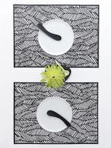 Inspired by traditional Japanese prints, the Drift Away placemats consist of delicate cutout patterns.