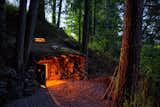 Some cabins are underground, or in the book’s taxonomy, Earthen. Dan Price’s former home was once broken into and the result was his commitment to live with fewer things, in nature. His hobbit-like home in Joseph, Oregon is complete with tunnels, crawlspaces, and a low-ceilinged bedroom. Using heavy-guage sheeting and wooden structures as roofing elements, he covered the space with dirt to facilitate natural growth above.