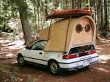 Among the more interesting inclusions in the book's “Salvaged” category is Jay Nelson’s Honda Civic camper. The fine woodwork shaping the arched living space provides a striking contrast to the vehicle below.