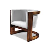 A steam-bent, solid wood frame seems to defy gravity in the Wendell Lounge chair.
