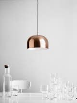 A closer look at the copper GM Pendant light, shown with Menu’s stackable glasses.  Search “spinning bh2 pendant light large black” from A Modern Classic | Grethe Meyer’s GM Pendants