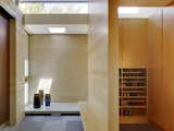 A traditional genkan (a Japanese entryway) was part of the architectural program early on. Shoes are removed before entering the main living space, which is elevated six inches above the floor level of the entryway. The blonde wood is rift-cut white oak.  Photo 6 of 11 in 11 Ways to Create a Modern Mudroom in Your Home from Designs Inspired by Japanese Architecture and Craft