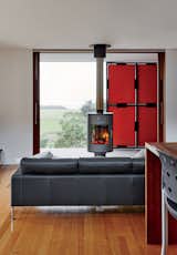 The fireplace, by Rais, can rotate in different directions for both indoor and outdoor use.  Search “off-the-grid” from An Off-the-Grid Prefab that Combines Open Plan Living With Rugged Durability