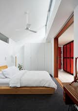 A wardrobe from IKEA and a bed by Rye Dunsmuir outfit one of two bedrooms.  Photo 19 of 29 in Reference by Muhammad Suryo Aji Riyanto from An Off-the-Grid Prefab that Combines Open Plan Living With Rugged Durability