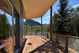 “I wanted to create ‘defensible’ outdoor rooms that flowed in and around the buildings,” Coleman said. The deck was built with Red Balau hardwood, which has a custom oil finish by Messmer’s.  Photo 9 of 10 in This Retreat in the Cascades is a Bold Take on the Modern Cabin