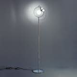 The Miconos Floor Lamp, designed by Ernesto Gismondi for Artemide, is a floor luminaire that provides diffused incandescent lighting. The orb diffuser is made of transparent hand-blown glass and the handle is accented by a chrome-plated steel handle. 

This lamp is 15% off until October 22, 2015.  Search “fluoro-shade.html” from Lighting Picks from Our Semi-Annual Sale