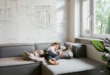 The modular Carmo sofa from BoConcept, ideal for naps and watching TV, can also be reconfigured as needed.  Search “boconcept” from This Tiny Warsaw Studio Instantly Changes from Office to Playroom