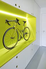 The owner is an avid cyclist; the guest apartment's hallway entrance features this unique storage space for his roadbike. Old damaged floors were replaced with a durable polyurethane coating.