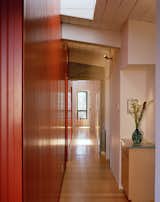 Preserving much of the original floor plan meant keeping this long hallway leading to most of the bedrooms.