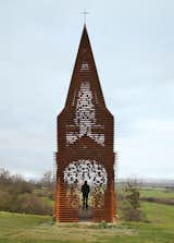 The Belgian firm Gijs Van Vaerenbergh constructed a see-through steepled chapel in Cor-Ten steel in 2011.