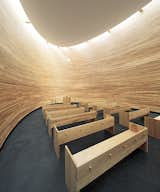 Known as the Chapel of Silence, the skylit, curved wooden structure is designed for quiet meditation.  Photo 17 of 21 in You Won't Believe That These Incredible Modern Buildings are Chapels and Synagogues