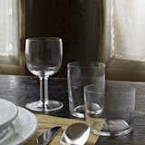 The Glass Family was designed by Jasper Morrison in 2008 and includes a goblet, red wine glass, white wine glass, and water glass. Each piece in the collection is exceedingly simple and is made in Italy from crystal glass. Of the collection, designer Jasper Morrison says, “This is all you need to set out a great daily table.”