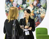 Attendees network in front of a digitally printed rug by Moooi.
