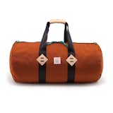 The classic Duffle Bag from Colorado’s Topo Designs is designed with travel and commuting in mind. The 24-inch long bag has a 42-liter capacity, making it an ideal companion for a weekend trip or even a trip to the Laundromat.  Photo 2 of 10 in Autumnal Color Crush: 10 Designs in Eye-Catching Orange by Marianne Colahan