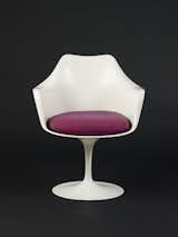 Saarinen designed his famous Tulip armchair as part of the Pedestal collection for Knoll in 1956 (manufacturing began the following year). With its minimal base and narrow, simple stem, the clean-lined design aimed to provide a solution to clunkier designs of, in the designer's own words, "ugly, confusing, unrestful world."